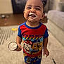 Jacob joined the competition — help win amazing prizes! toddler, child, smiling, pajamas, ice_cream, cone, face, happy, indoors, carpet, furniture, living_room, person, clothing, footwear, cute, messy, celebration, fun, portrait