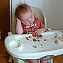 baby, toddler, high_chair, sleeping, messy_hair, food_crumbs, snack, indoor, wood_floor, plastic_chair, child, casual, messy, clothing, face, hand, foot, wooden_door, tray, furniture