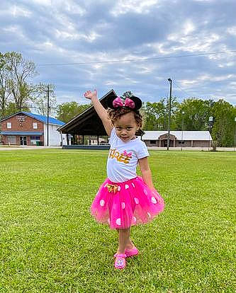Gypsy is registered to the contest to win money with this photo: baby_toddler_clothing, cloud, fun, grass, grassland, happy, house, landscape, lawn, leisure, magenta, meadow, people_in_nature, person, pink, plant, recreation, sky, summer, toddler