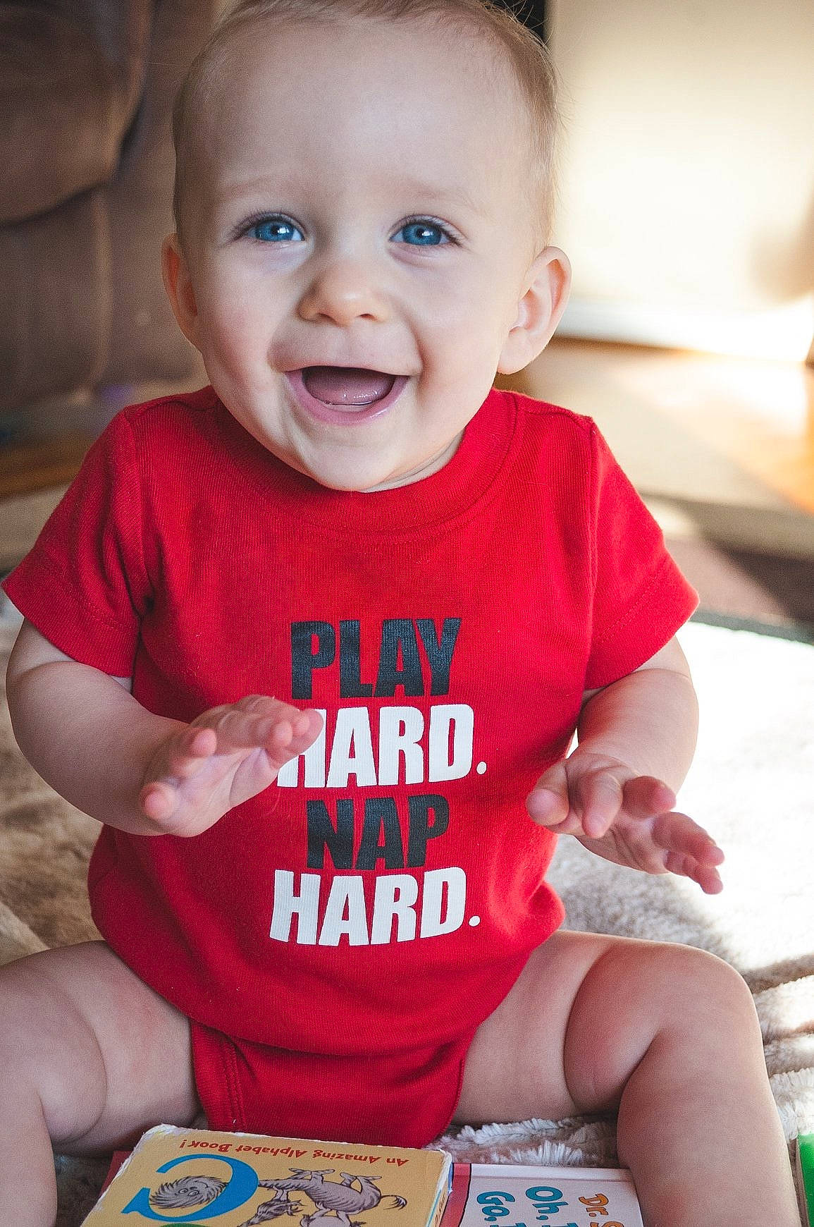 Talon joined the competition — help win amazing prizes! baby, baby_toddler_clothing, cheek, child, eye, face, facial_expression, happy, head, lip, people, person, play, product, red, sitting, skin, sleeve, smile, t_shirt