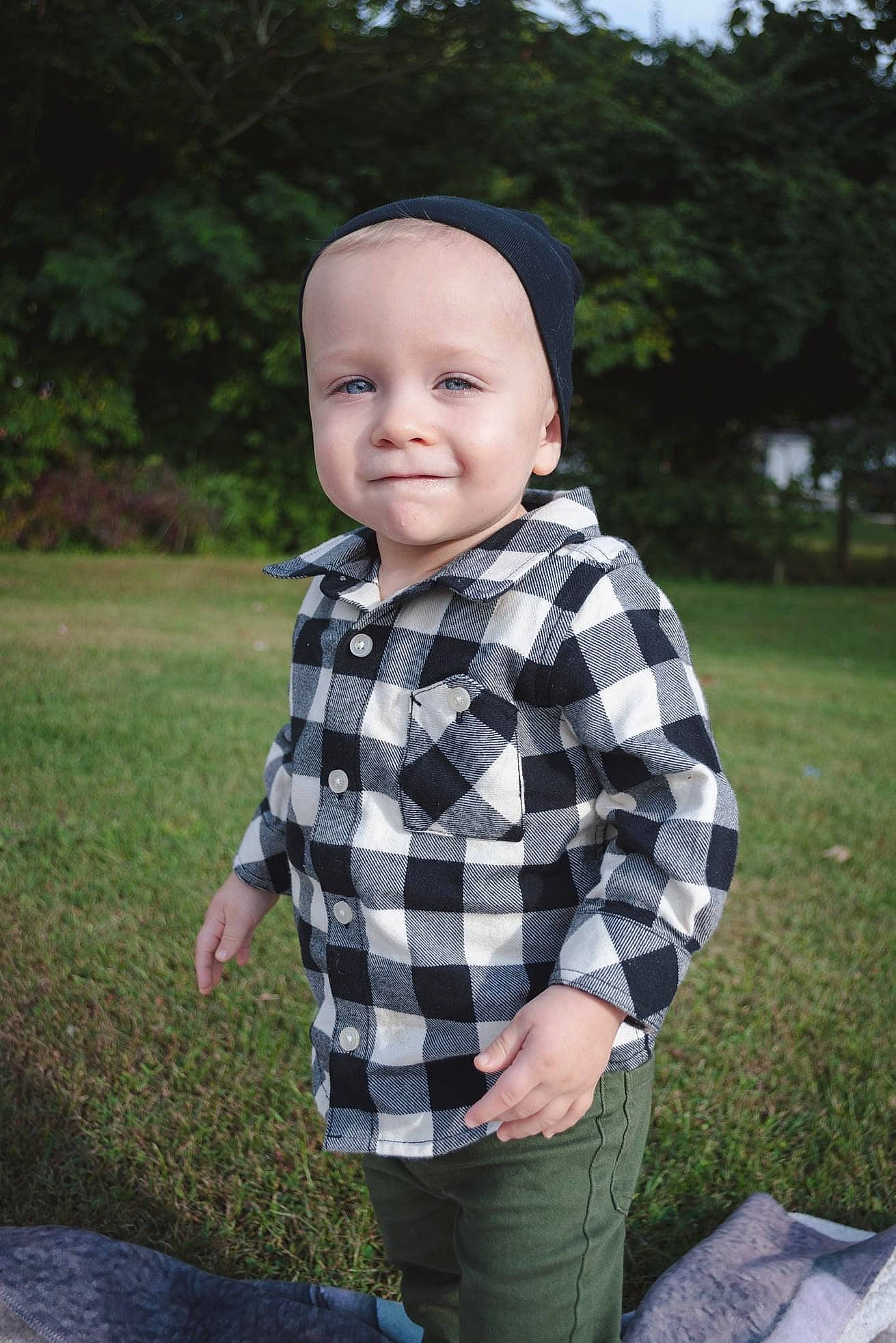 Talon is registered to the contest to win money with this photo: baby, baby_toddler_clothing, child, face, flash_photography, fun, garden, grass, happy, head, pattern, person, plaid, plant, sitting, sleeve, smile, t_shirt, tartan, toddler
