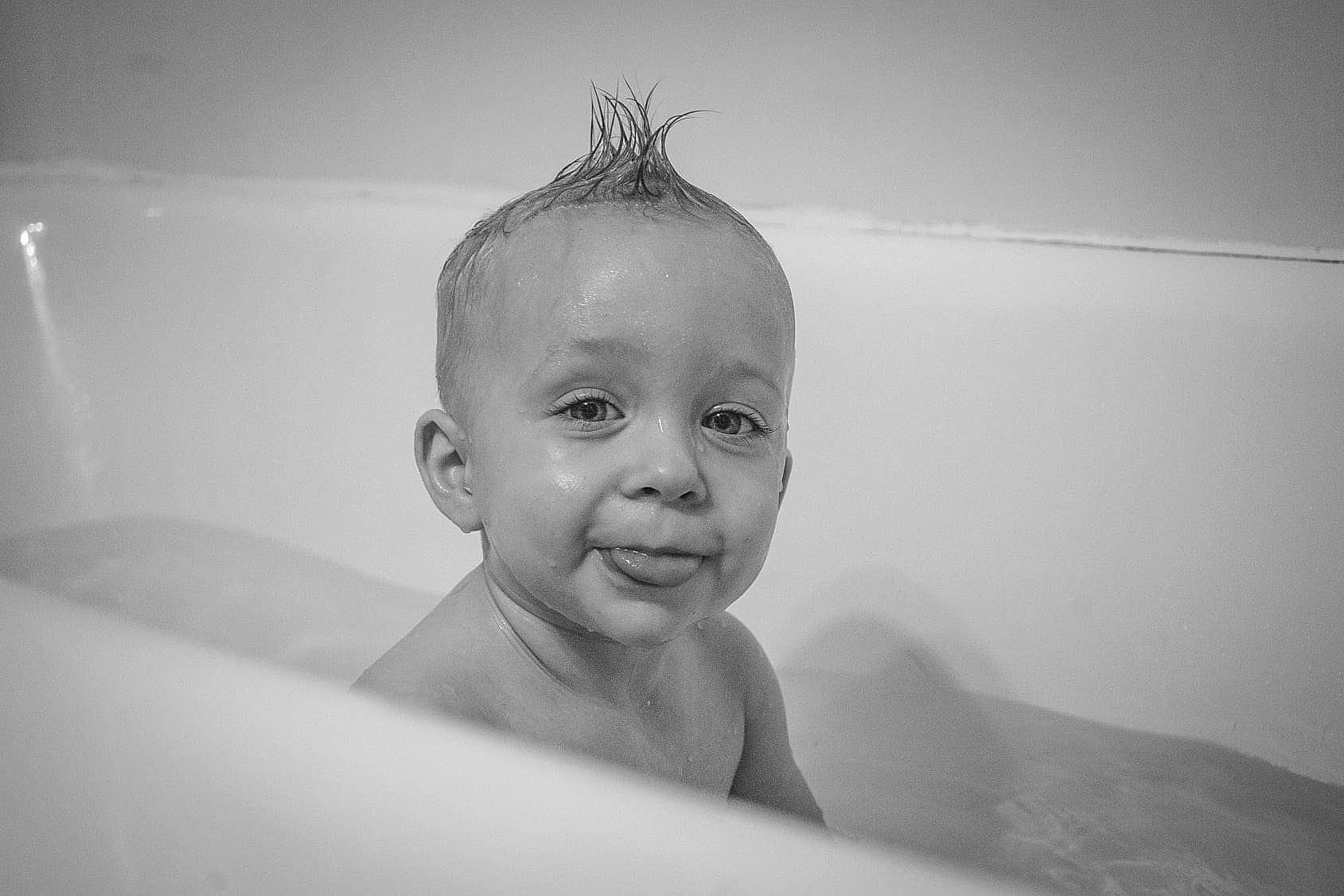 Talon is registered to the contest to win money with this photo: bathing, bathroom, bathtub, cheek, chin, ear, eye, eyebrow, eyelash, face, fluid, hair, jaw, lip, mouth, neck, nose, person, plumbing_fixture, smile