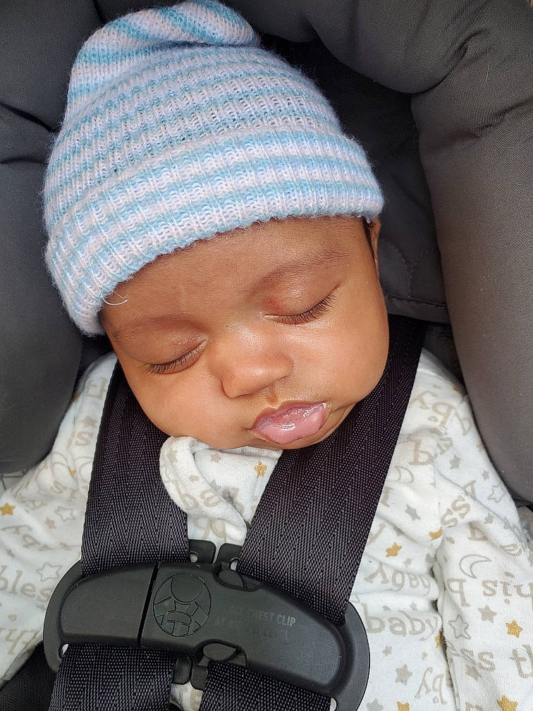 Drayden is registered to the contest to win money with this photo: baby, baby_in_car_seat, baby_sleeping, baby_toddler_clothing, cap, car_seat, cheek, child, comfort, headwear, knit_cap, nose, outerwear, person, product, skin, sleeve, textile, toddler, white