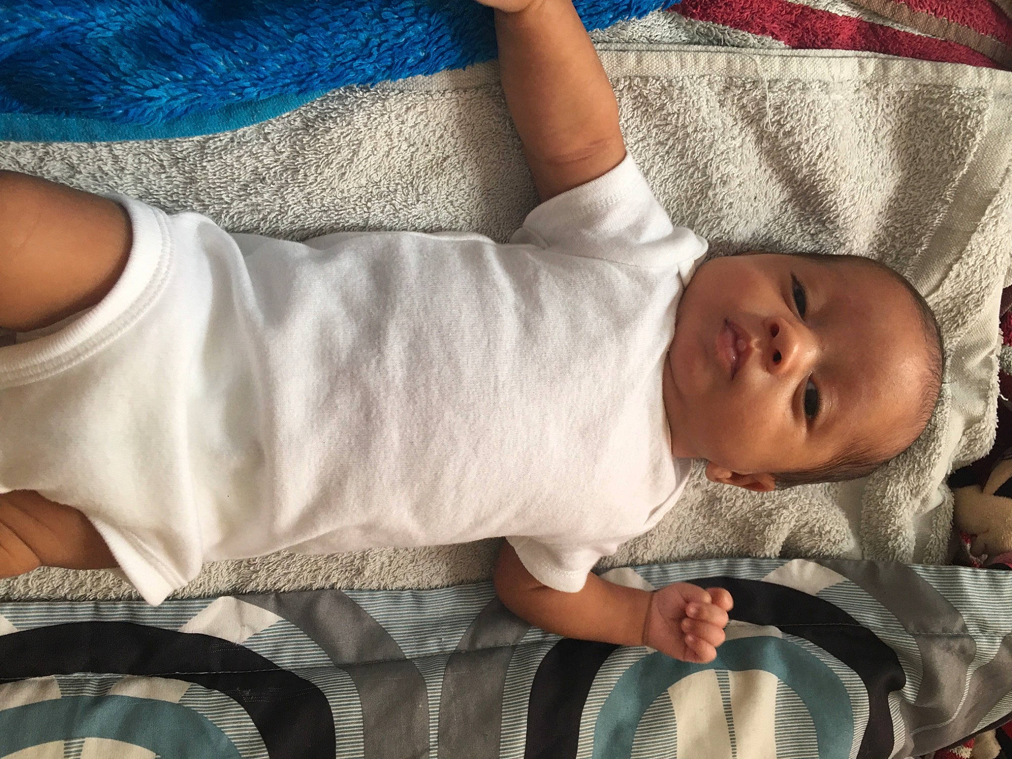 Drayden is registered to the contest to win money with this photo: arm, baby_toddler_clothing, black, blue, cheek, chin, comfort, eye, gesture, hand, human_body, mouth, nose, organ, person, photograph, product, skin, sleeve, textile