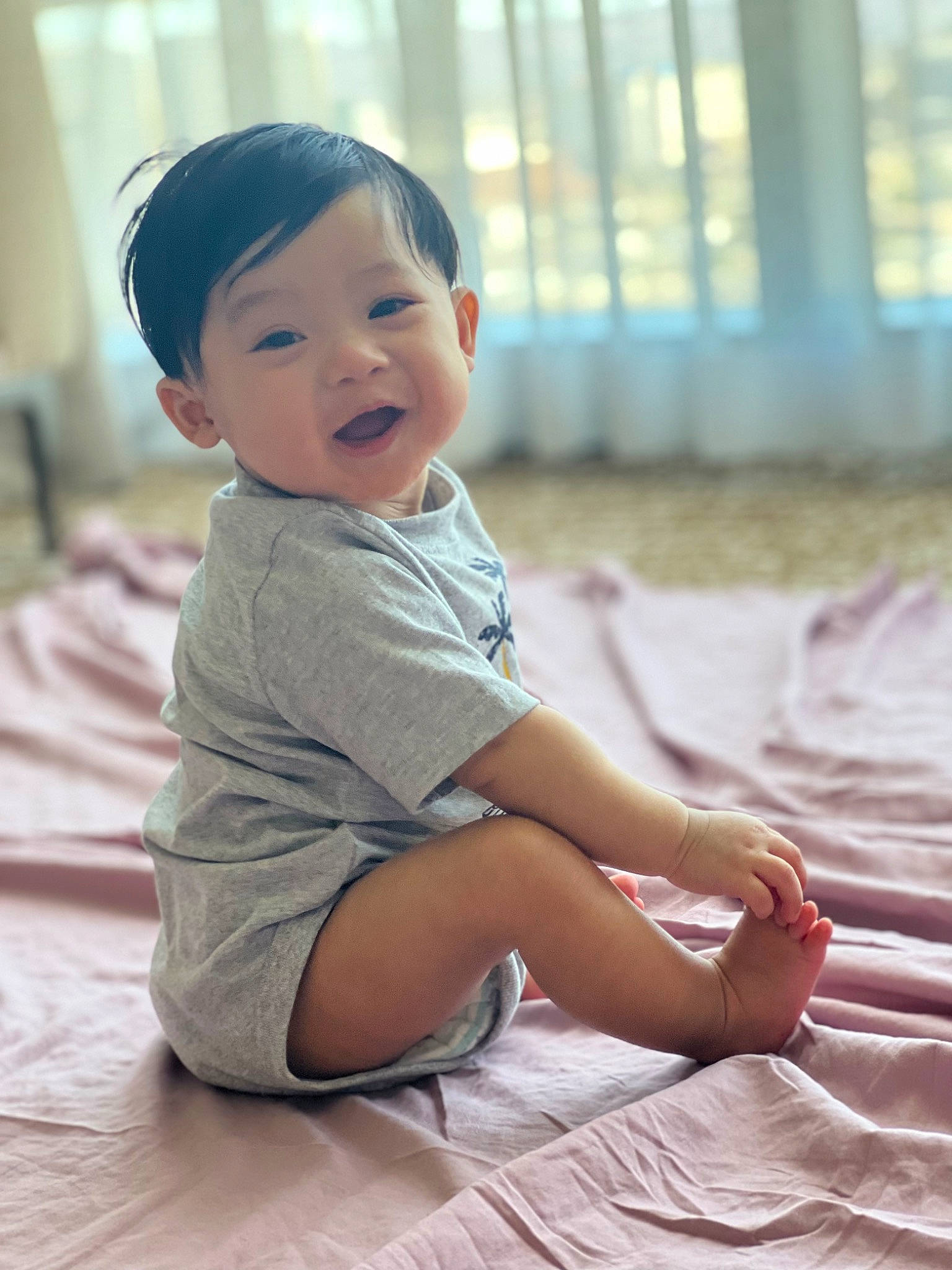 Chozen joined the competition — help win amazing prizes! baby, baby_toddler_clothing, cheek, child, finger, floor, flooring, fun, happy, leisure, mammal, person, pink, shorts, sitting, skin, sleeve, smile, toddler, vertebrate