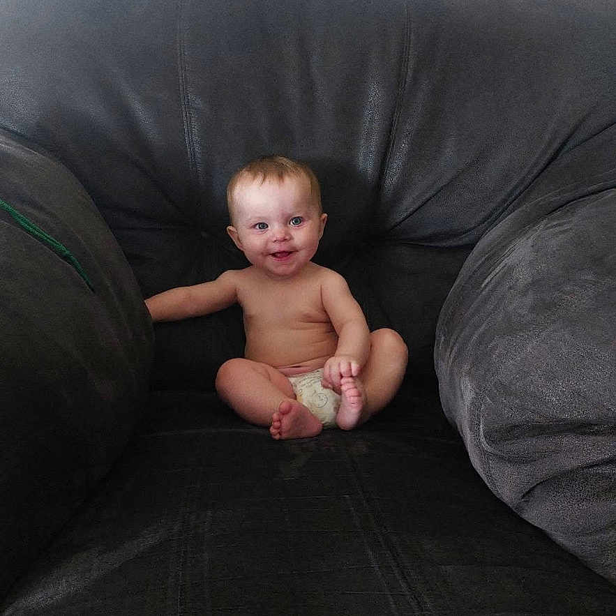 Iylah joined the competition — help win amazing prizes! armchair, baby, casual, child, childcare, comfort, cozy, cute, diaper, furniture, happy, indoor, infant, person, portrait, seat, sitting, skin, smile, young