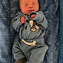 Simon is registered to the contest to win money with this photo: newborn, baby, sleeping, blue_outfit, blanket, cozy, infant, child, cute, peaceful, portrait, clothing, soft, resting, person, indoors, small_hands, closed_eyes, baby_clothes, warm