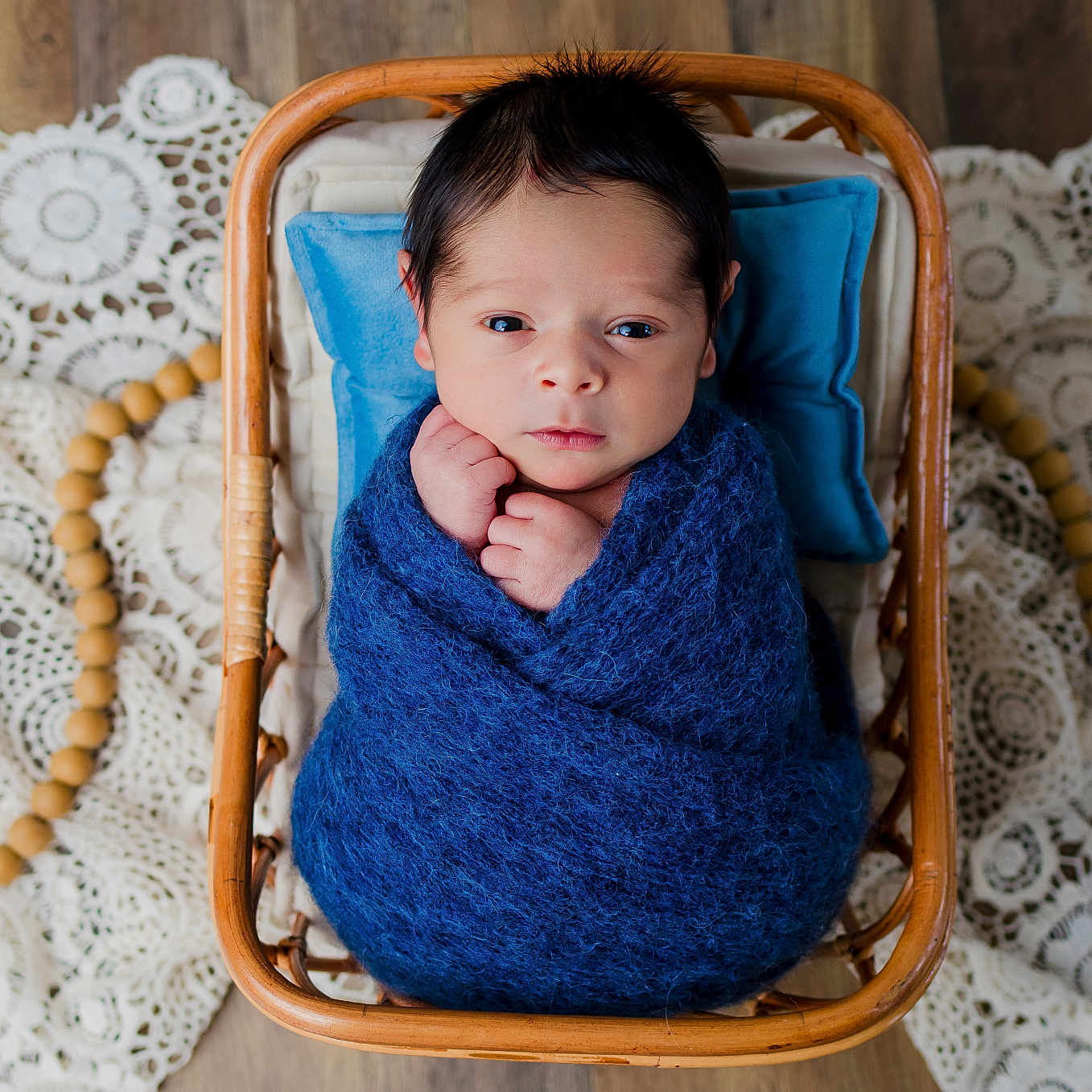 Mateo joined the competition — help win amazing prizes! baby, basket, bed, blanket, clothing, cradle, crib, face, furniture, hardwood, head, homedecor, infantbed, knitwear, linen, newborn, person, sweater, towel, wood