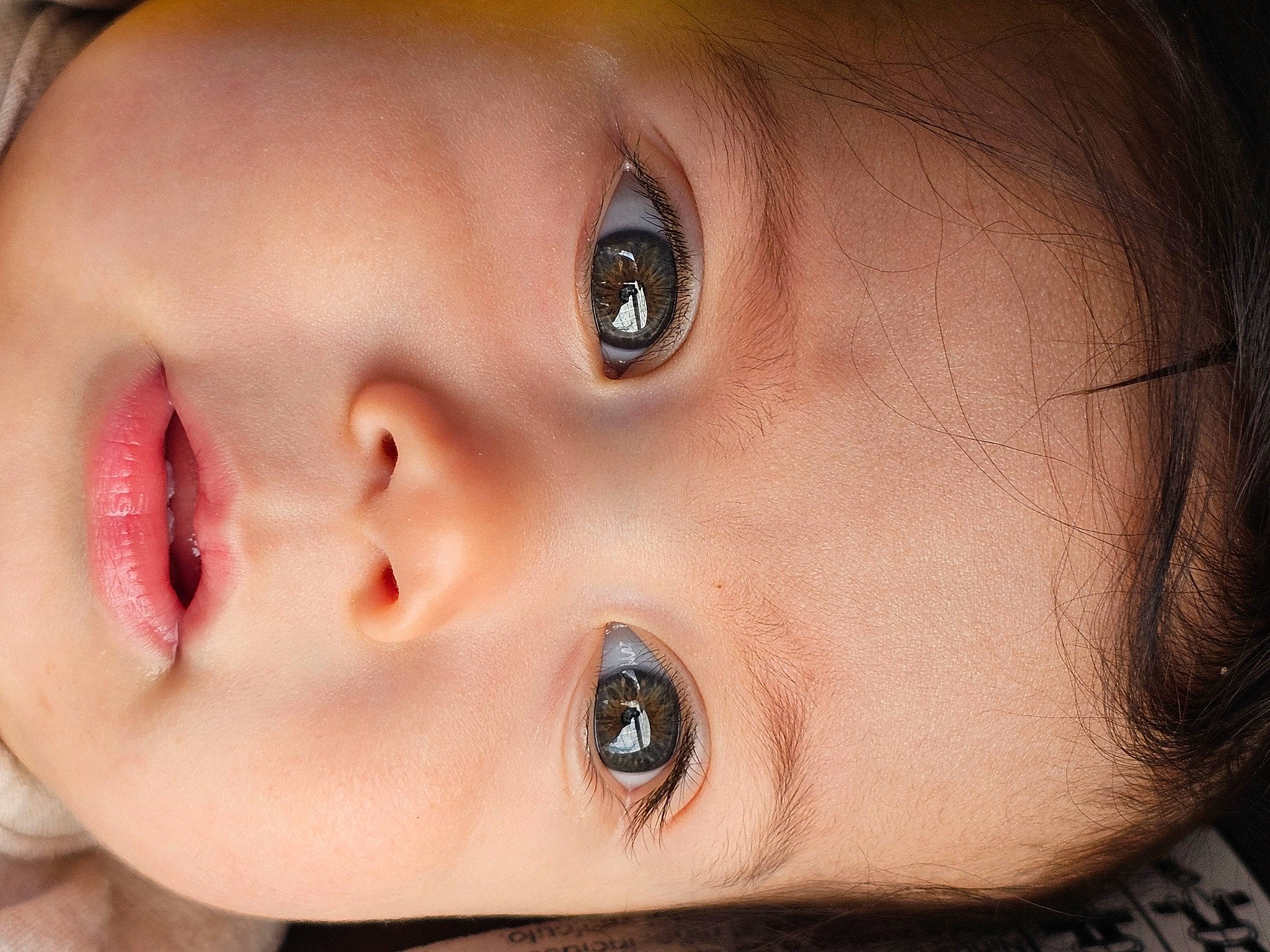 Judah is registered to the contest to win money with this photo: baby, cheek, chin, ear, eye, eyebrow, eyelash, face, facial_expression, flash_photography, forehead, happy, human, iris, lip, mouth, no_expression, nose, person, skin