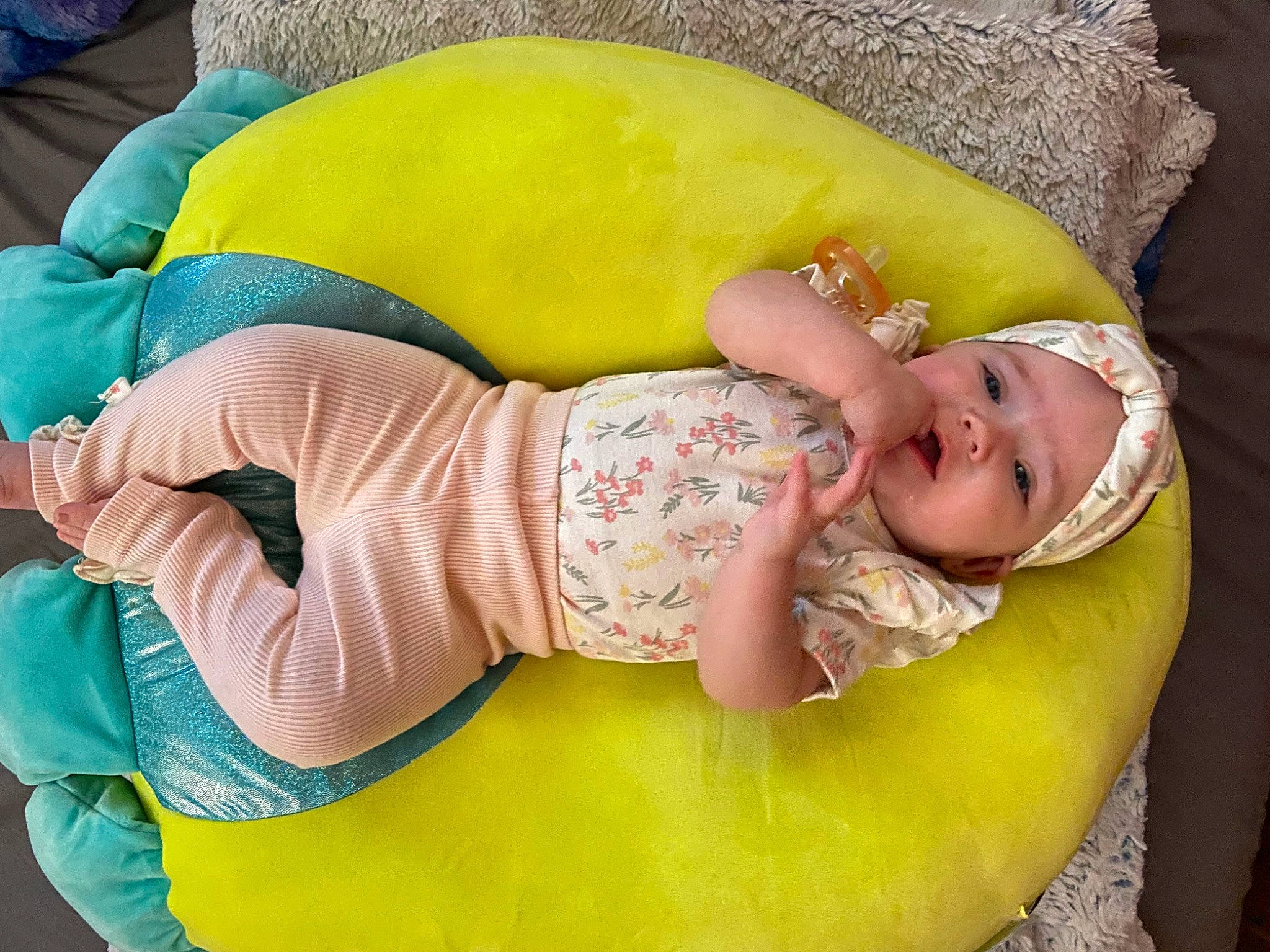 Faith is registered to the contest to win money with this photo: arm, baby, baby_products, baby_safety, baby_sleeping, baby_toddler_clothing, bedtime, child, clothing, comfort, facial_expression, happy, headwear, human_body, linens, person, pink, skin, sleeve, textile