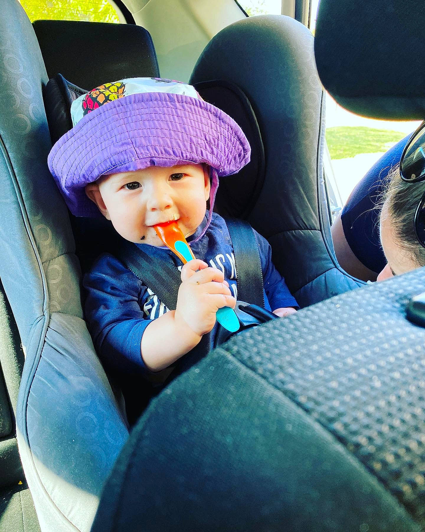 Alec is registered to the contest to win money with this photo: auto_part, automotive_design, automotive_exterior, blue, cap, car, car_seat, car_seat_cover, comfort, cool, electric_blue, fun, head_restraint, headwear, motor_vehicle, person, steering_wheel, tints_and_shades, toddler, travel