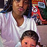 teenager, newborn, baby, child, portrait, selfie, cuddling, sitting, face, smile, pout, braids, white_shirt, infant, comic_books, bedroom, indoor, family, closeup, photography