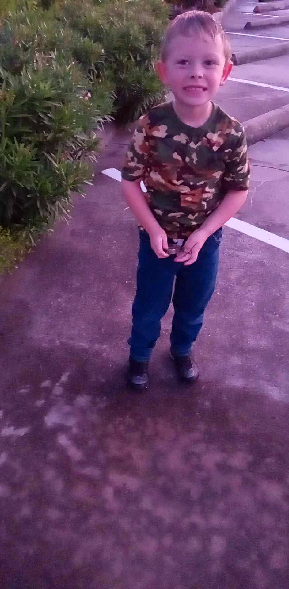 Axl joined the competition — help win amazing prizes! asphalt, child, denim, electric_blue, eyewear, fun, gesture, grass, joy, magenta, military_camouflage, pattern, person, plant, purple, recreation, sleeve, soil, t_shirt, thumb