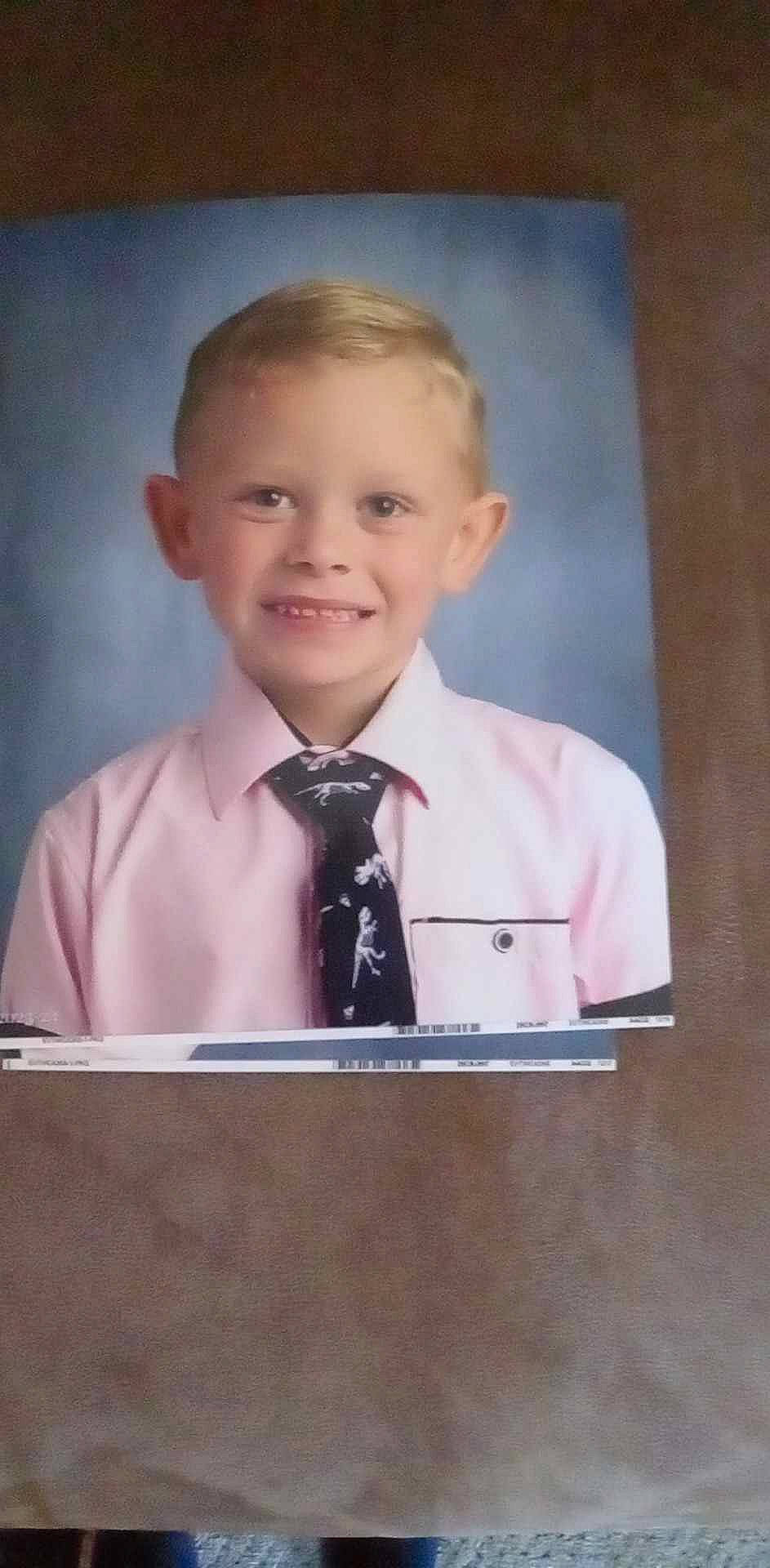 Axl joined the competition — help win amazing prizes! blazer, collar, dress_shirt, event, formal_wear, gesture, joy, lectern, microphone, official, orator, person, podium, public_speaking, school_uniform, sleeve, smile, speech, spokesperson, tie