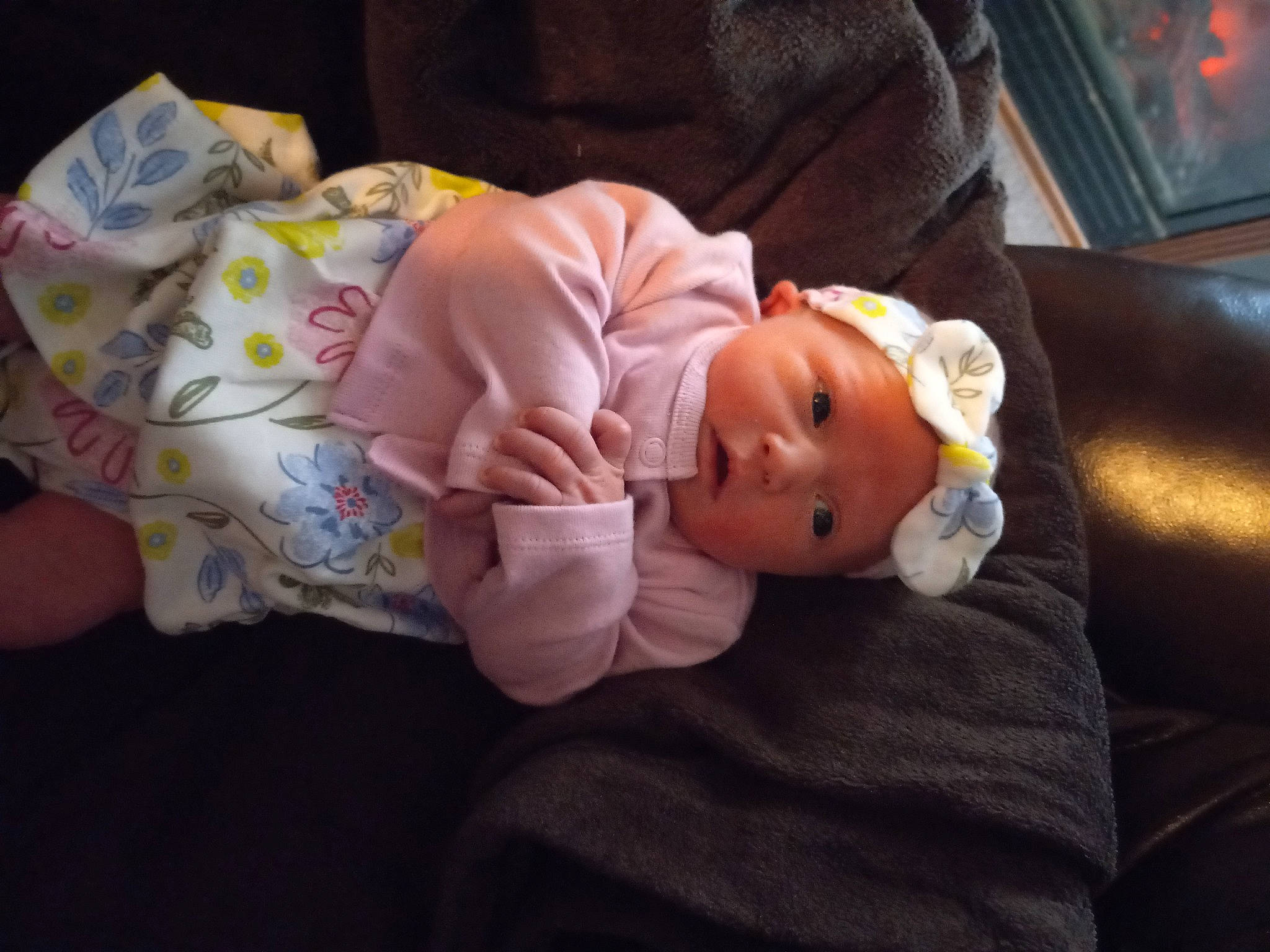 Deborah is registered to the contest to win money with this photo: baby, baby_products, baby_toddler_clothing, child, comfort, hat, headwear, lap, linens, nap, person, picture_frame, room, sitting, sleep, toddler, wood