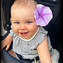 baby, baby_clothes, child, closeup, cute, face, flower, flower_accessory, happy, head, infant, outdoor, person, portrait, seat, skin, smile, striped_clothing, stroller, young_child
