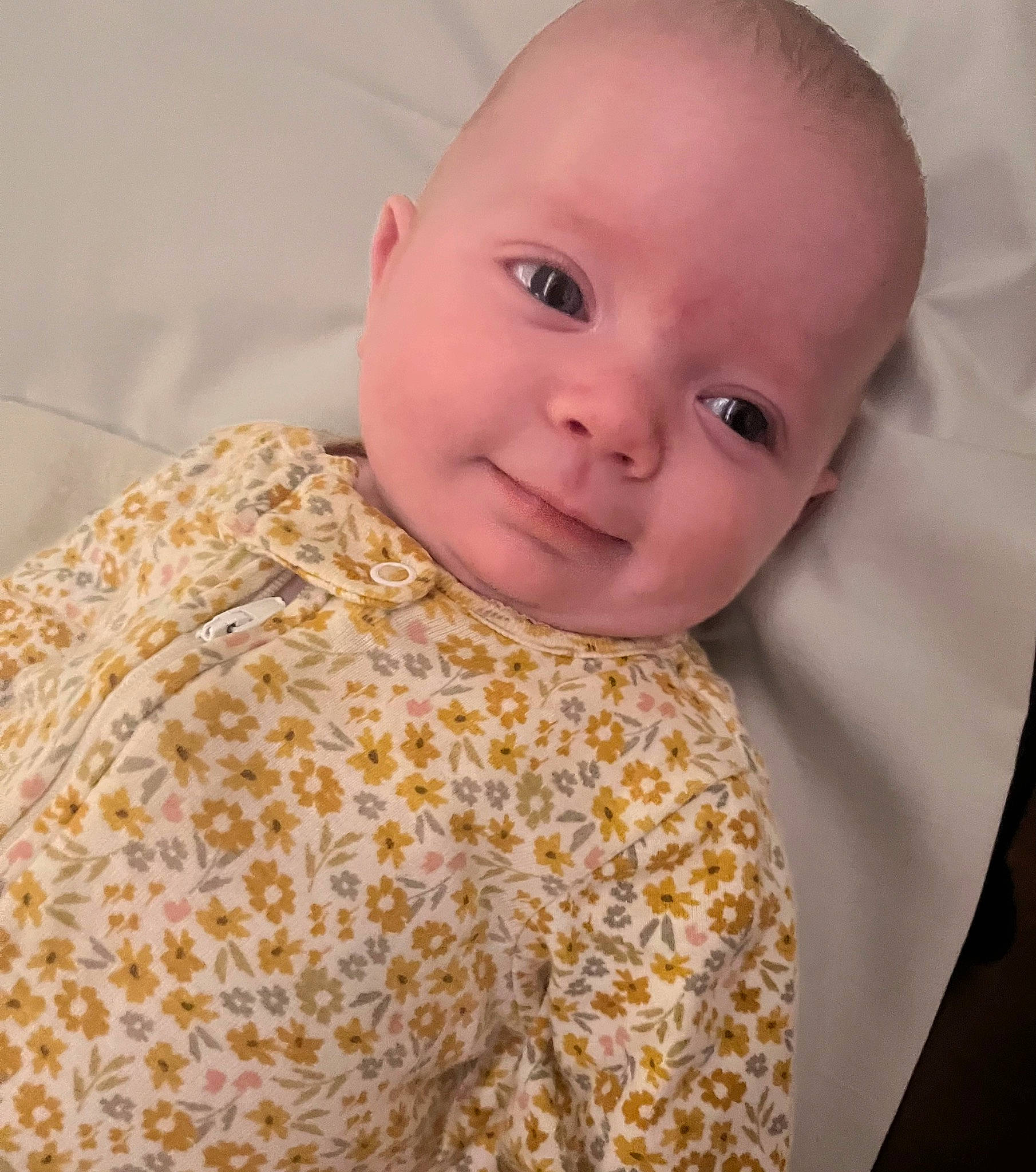 Nora is registered to the contest to win money with this photo: baby, baby_toddler_clothing, cheek, chin, collar, comfort, eye, eyebrow, face, facial_expression, happy, headgear, iris, lip, nose, person, skin, sleeve, smile, textile