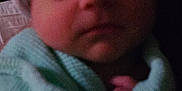 Russell joined the competition — help win amazing prizes! baby, blanket, child, closeup, cozy, cute, face, hat, headwear, indoor, infant, newborn, person, portrait, resting, sleeping, soft, toddler, warm, wrapped