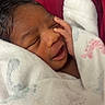 Dominique joined the competition — help win amazing prizes! newborn, baby, smiling, sleeping, blanket, wrapped, infant, face, hand, cozy, cute, resting, soft, fabric, red, white, portrait, closeup, peaceful, child