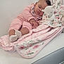 Avani joined the competition — help win amazing prizes! baby, sleeping, pink_clothing, blanket, plush_toy, couch, white_couch, floral_pattern, wallpaper, infant, indoors, cozy, resting, child, soft_toy, peaceful, furniture, home_interior, baby_sleep, comfort