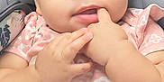 Avani joined the competition — help win amazing prizes! baby, infant, child, car_seat, pink_shirt, floral_pattern, hand, finger_in_mouth, curious_eyes, chubby_cheeks, seatbelt, stroller, close_up, portrait, cute, indoor, soft_lighting, casual_clothing, expression, person