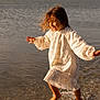 barefoot, beach, child, fun, girl, happy, motion, nature, outdoor, playing, portrait, sand, smiling, splashing, summer, sunlight, water, waves, white_dress, wind