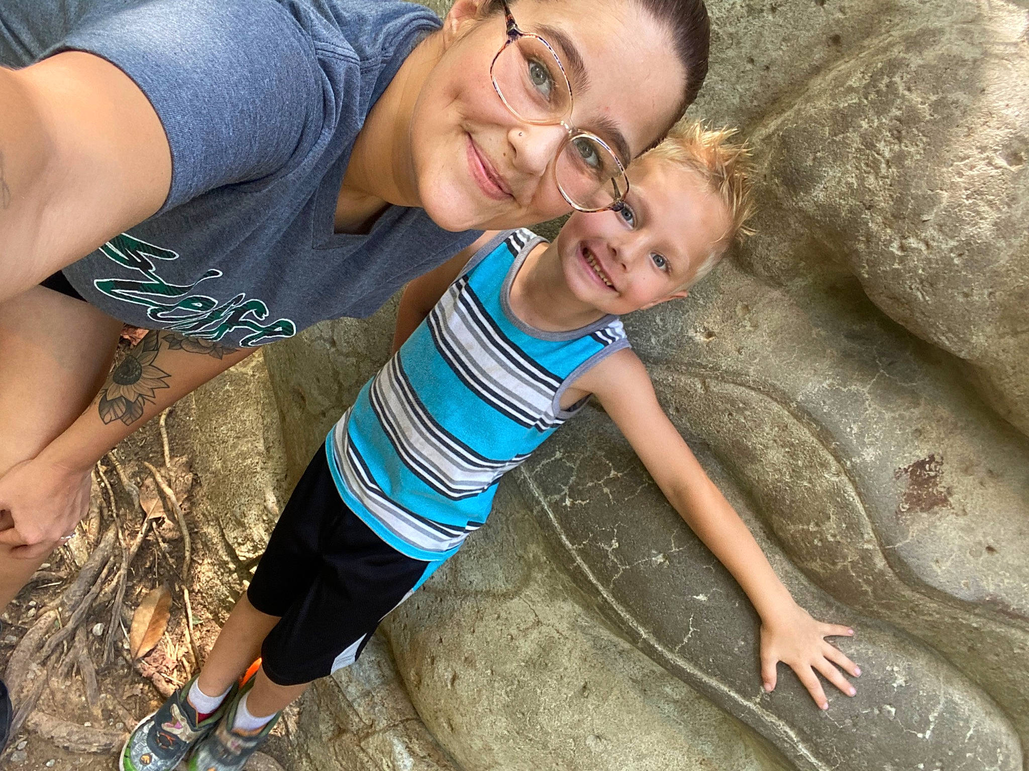 Robert is registered to the contest to win money with this photo: child, fun, gesture, grass, hair, happy, head, human_body, joy, leisure, people, people_in_nature, person, recreation, shorts, smile, snapshot, soil, summer, t_shirt