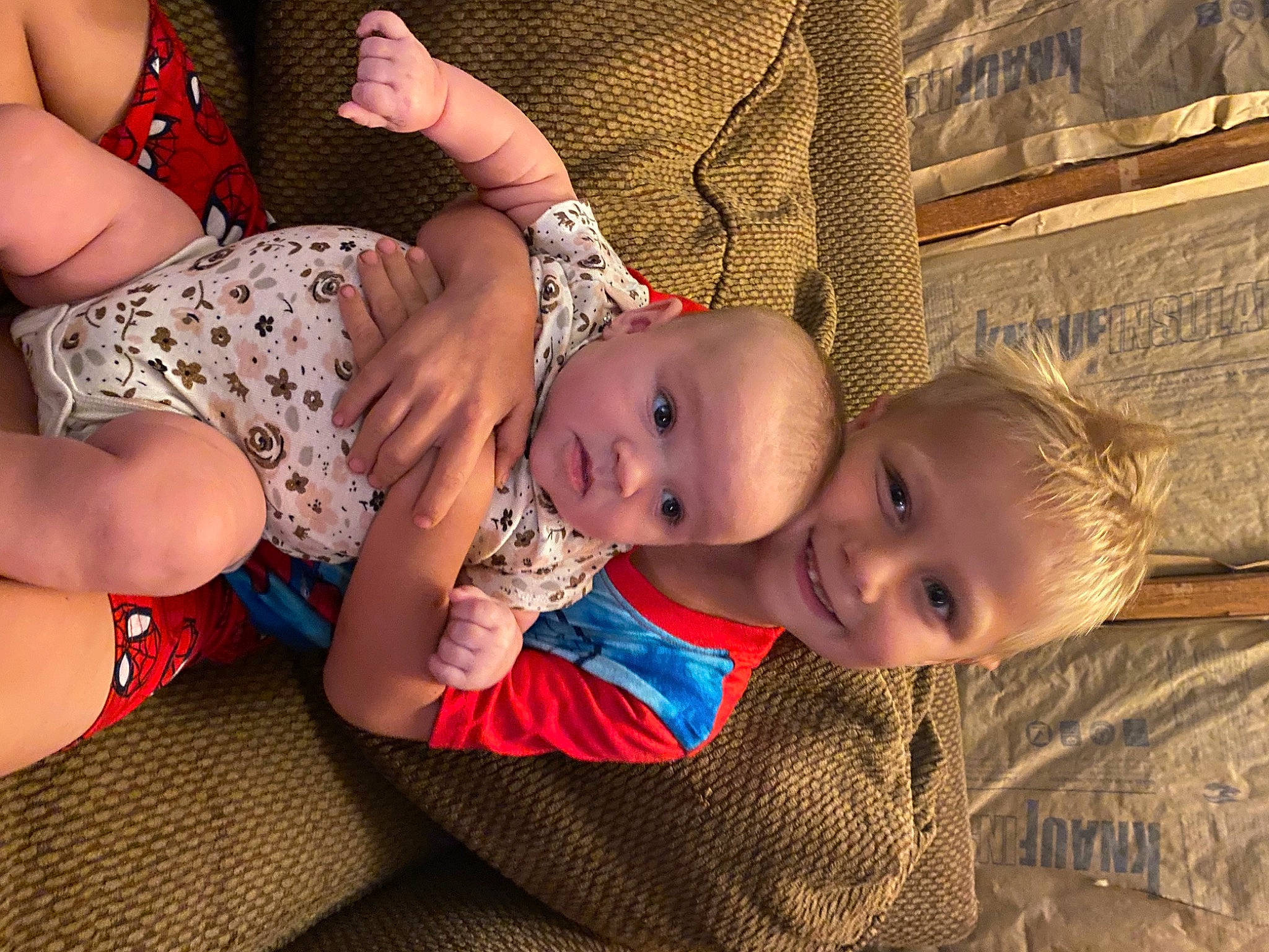 Robert is registered to the contest to win money with this photo: baby, baby_toddler_clothing, cheek, chest, comfort, fun, hairstyle, hand, happy, human_body, interaction, joy, lap, mouth, person, skin, smile, stomach, thigh, toddler