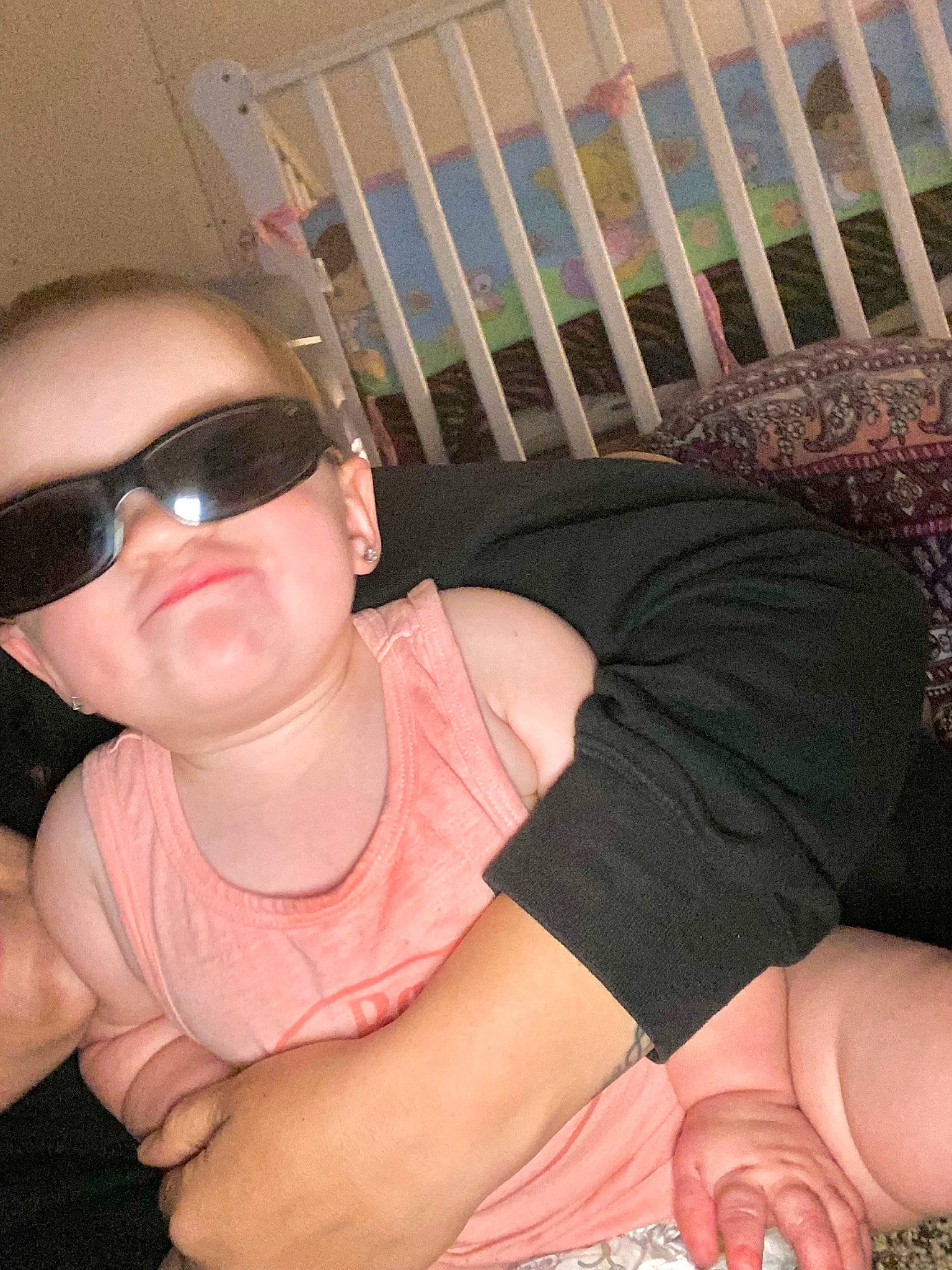 Anastacia is registered to the contest to win money with this photo: chest, comfort, elbow, eyewear, finger, goggles, human_body, human_leg, joint, knee, leg, muscle, neck, person, pink, sunglasses, t_shirt, thigh, thumb, trunk