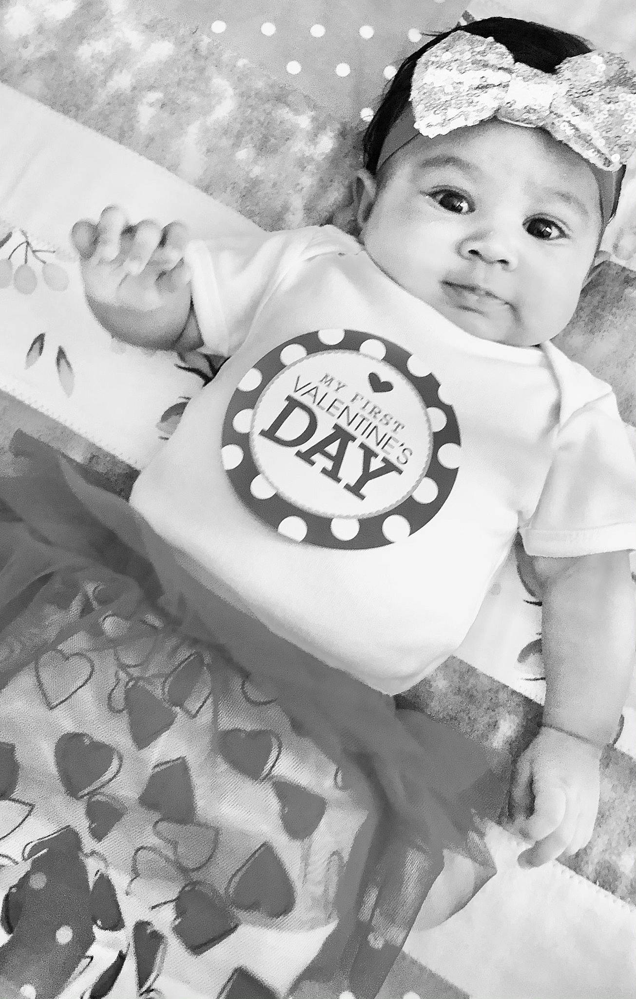 True is registered to the contest to win money with this photo: arm, baby_toddler_clothing, black, black_and_white, cool, facial_expression, flash_photography, fun, hairstyle, happy, headgear, iris, monochrome, monochrome_photography, organ, person, photograph, standing, style, toddler