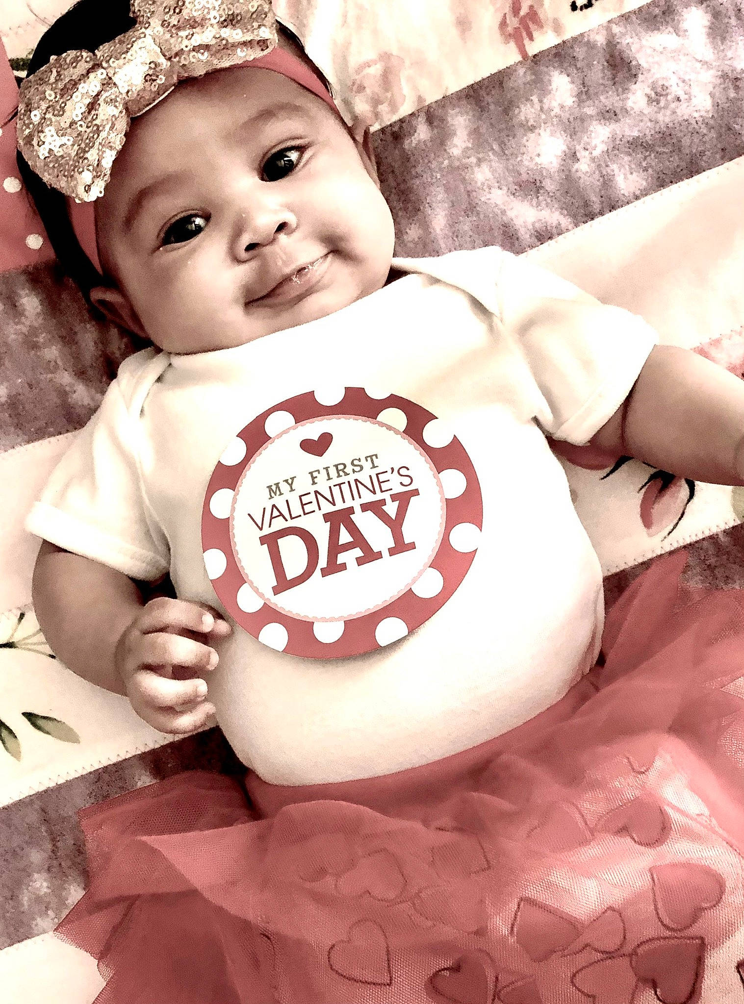 True is registered to the contest to win money with this photo: baby, baby_toddler_clothing, cap, cheek, eye, face, facial_expression, flash_photography, hairstyle, happy, head, headwear, human, person, photograph, pink, skin, sleeve, smile, t_shirt