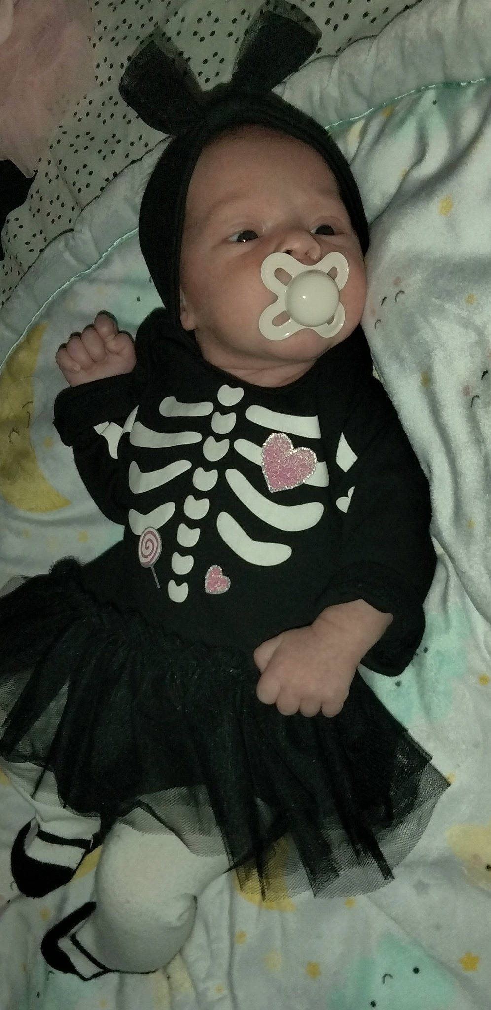 Makenzie joined the competition — help win amazing prizes! baby, baby_products, baby_toddler_clothing, cheek, child, comfort, day_dress, dress, eye, eyelash, face, head, human_body, iris, lip, pattern, person, sitting, skin, sleeve