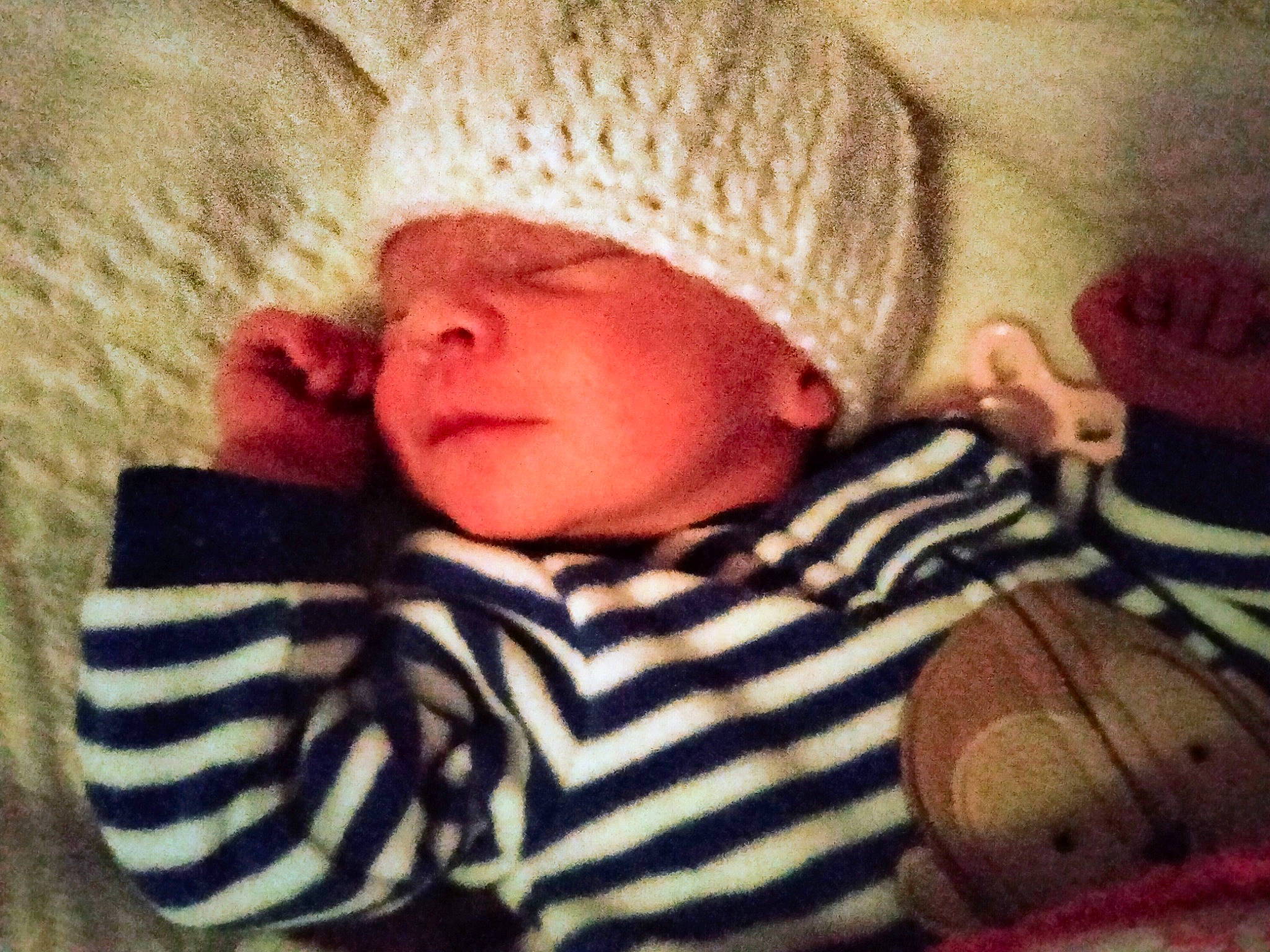 Makenzie joined the competition — help win amazing prizes! baby, baby_sleeping, baby_toddler_clothing, cap, cheek, child, cloud, comfort, cool, head, headwear, knit_cap, linens, morning, nose, organ, person, skin, sleeve, textile