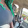 Oreo joined the competition — help win amazing prizes! person, smile, green_hair, sunglasses, dog, car_interior, seatbelt, harness, window, sunlight, happy, pet, leash, vehicle, dashboard, cup_holder, drink, casual_clothing, hand, portrait