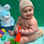 Kailan joined the competition — help win amazing prizes! baby, basket, blue_blanket, blue_bunny, bunny_hat, child, chubby, crocheted_carrot, cute, diaper_cover, easter_eggs, green_backdrop, happy, infant, knitted_hat, plush_toy, portrait, sitting, smiling, soft_toy