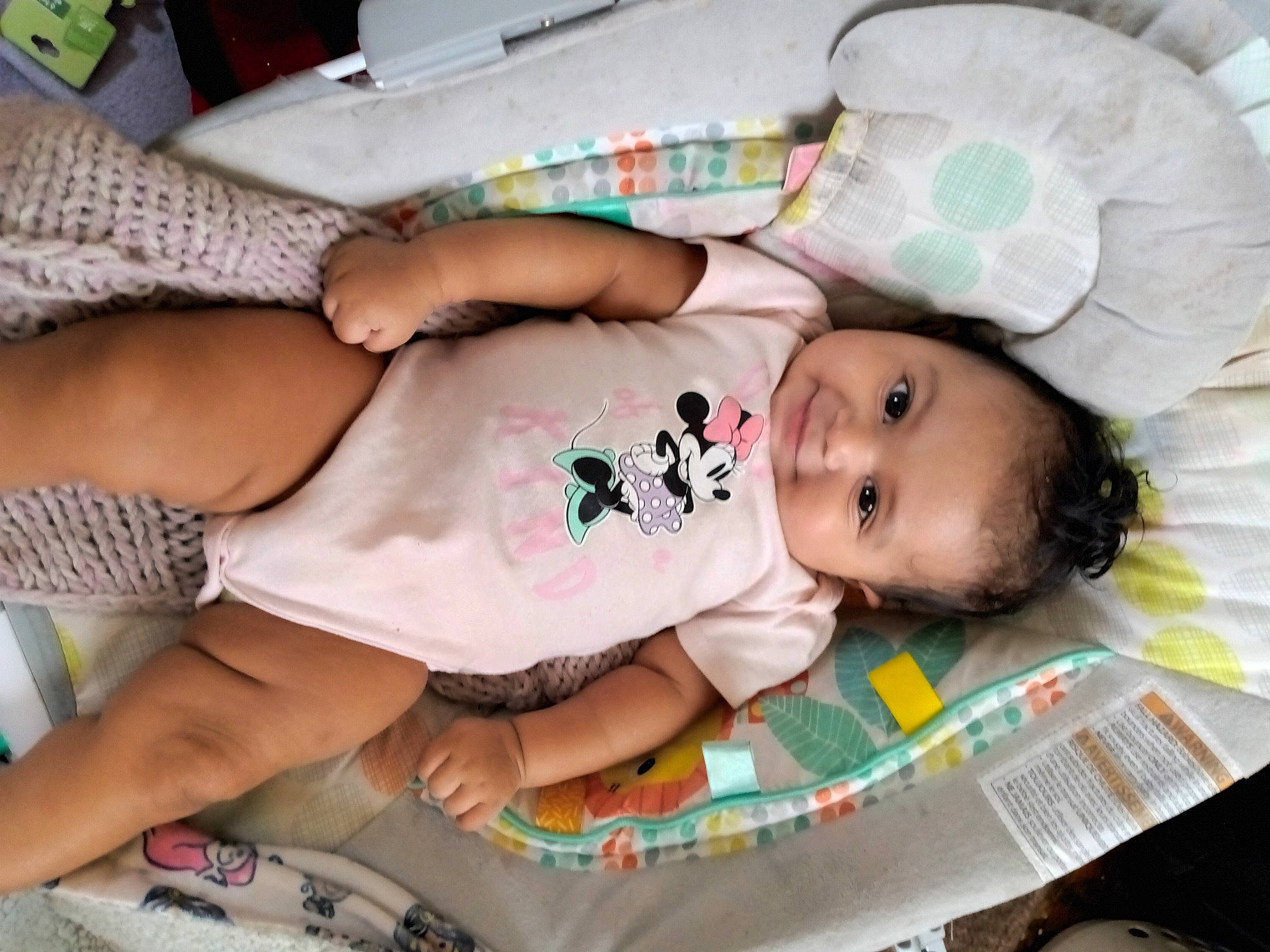 Ashanti is registered to the contest to win money with this photo: baby, baby_products, baby_toddler_clothing, cheek, child, comfort, foot, happy, human_leg, linens, nail, pattern, person, room, skin, thigh, toddler