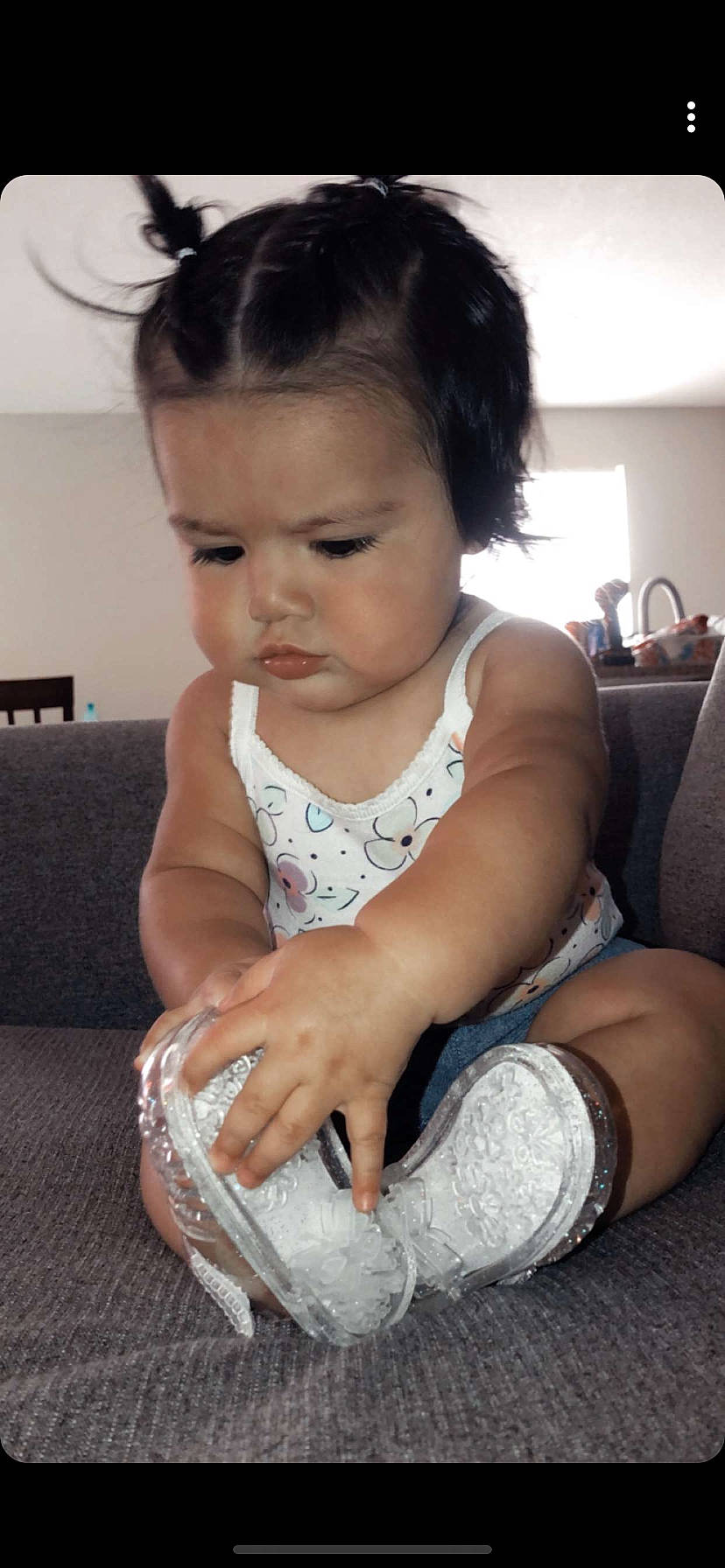 Zaila is registered to the contest to win money with this photo: arm, baby, cheek, child, elbow, hair, leg, person, sitting, smile, toddler