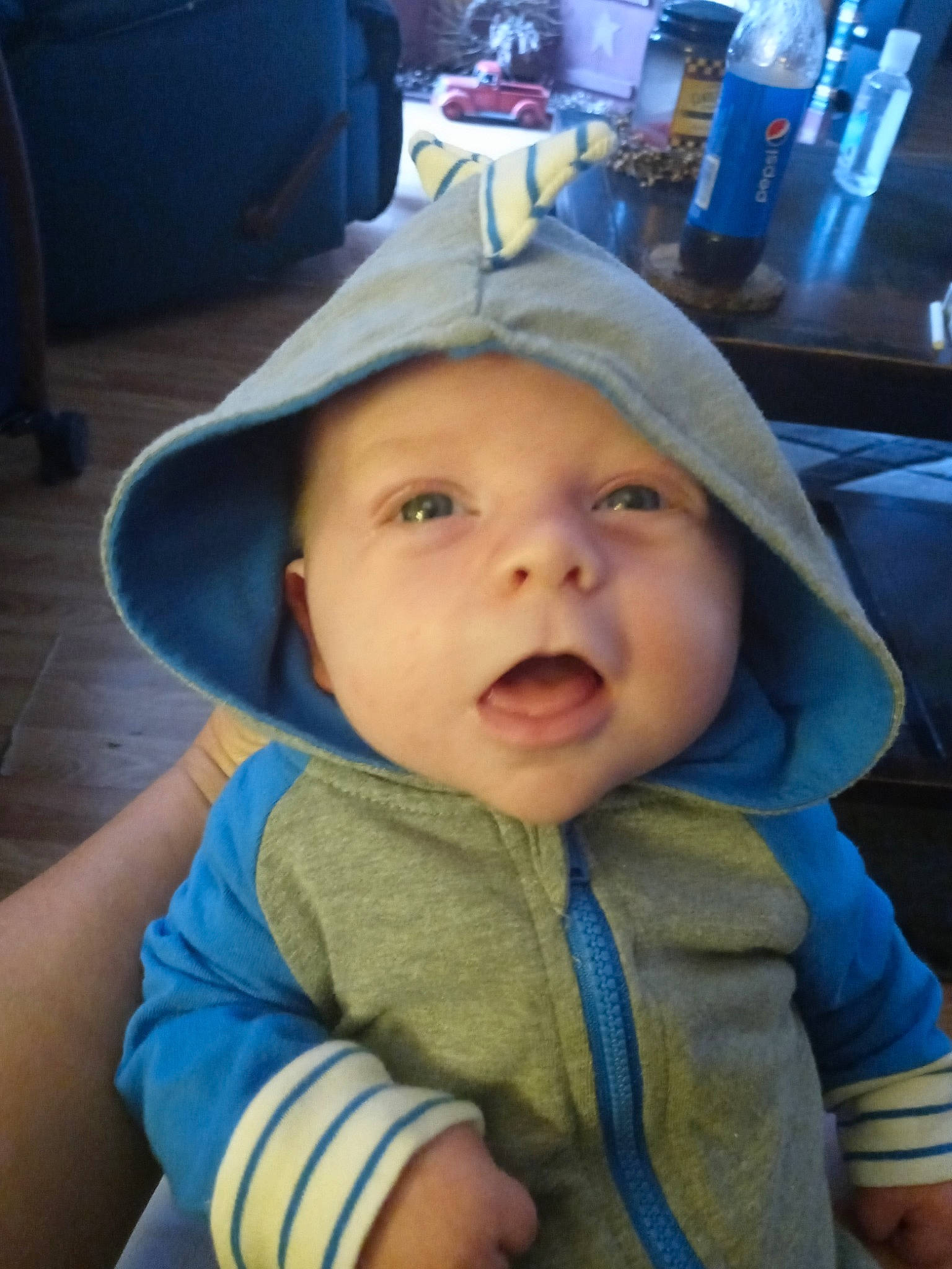 Brandon is registered to the contest to win money with this photo: baby, baby_toddler_clothing, blue, cap, cheek, chin, electric_blue, eye, eyebrow, finger, fun, happy, headwear, iris, jaw, lip, mouth, nose, person, skin