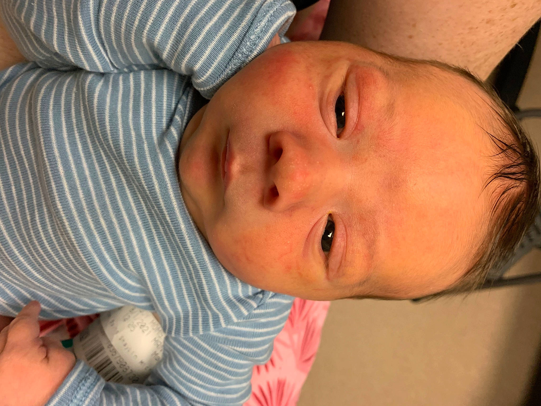 Royson is registered to the contest to win money with this photo: arm, baby, baby_toddler_clothing, cheek, chin, eye, eyebrow, eyelash, gesture, hair, hand, human_body, iris, lip, mammal, mouth, neck, nose, person, product