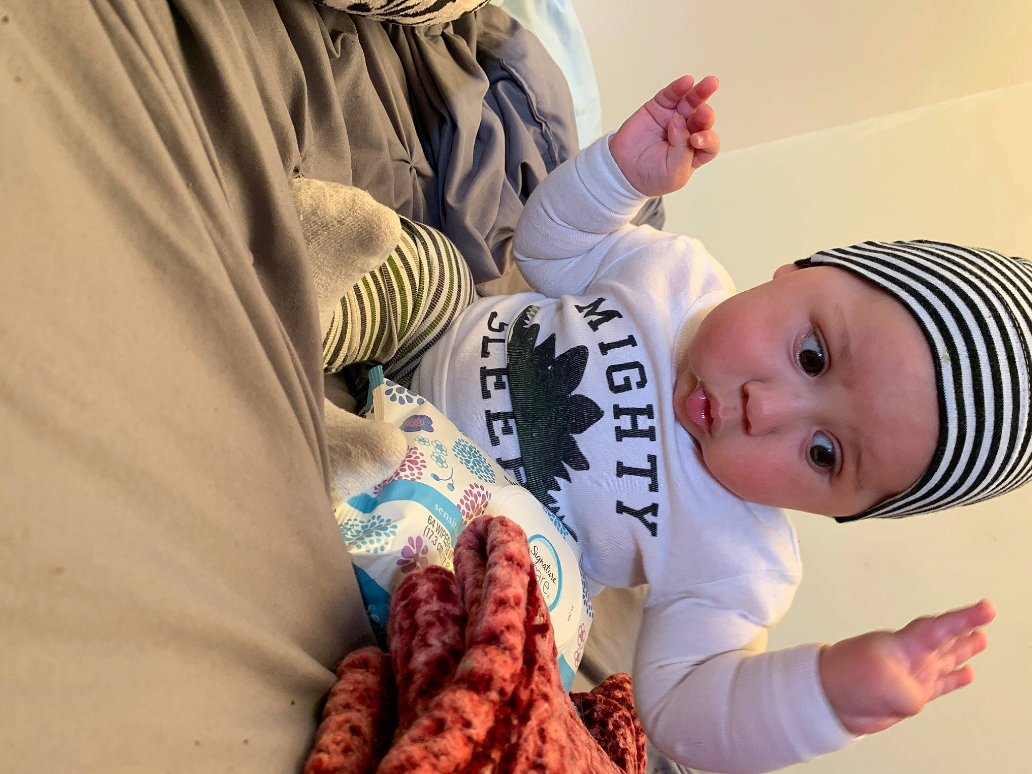 Royson is registered to the contest to win money with this photo: baby, baby_products, baby_sleeping, baby_toddler_clothing, child, comfort, eye, finger, fur, gesture, happy, hat, headwear, human, nail, person, room, skin, sleeve, textile