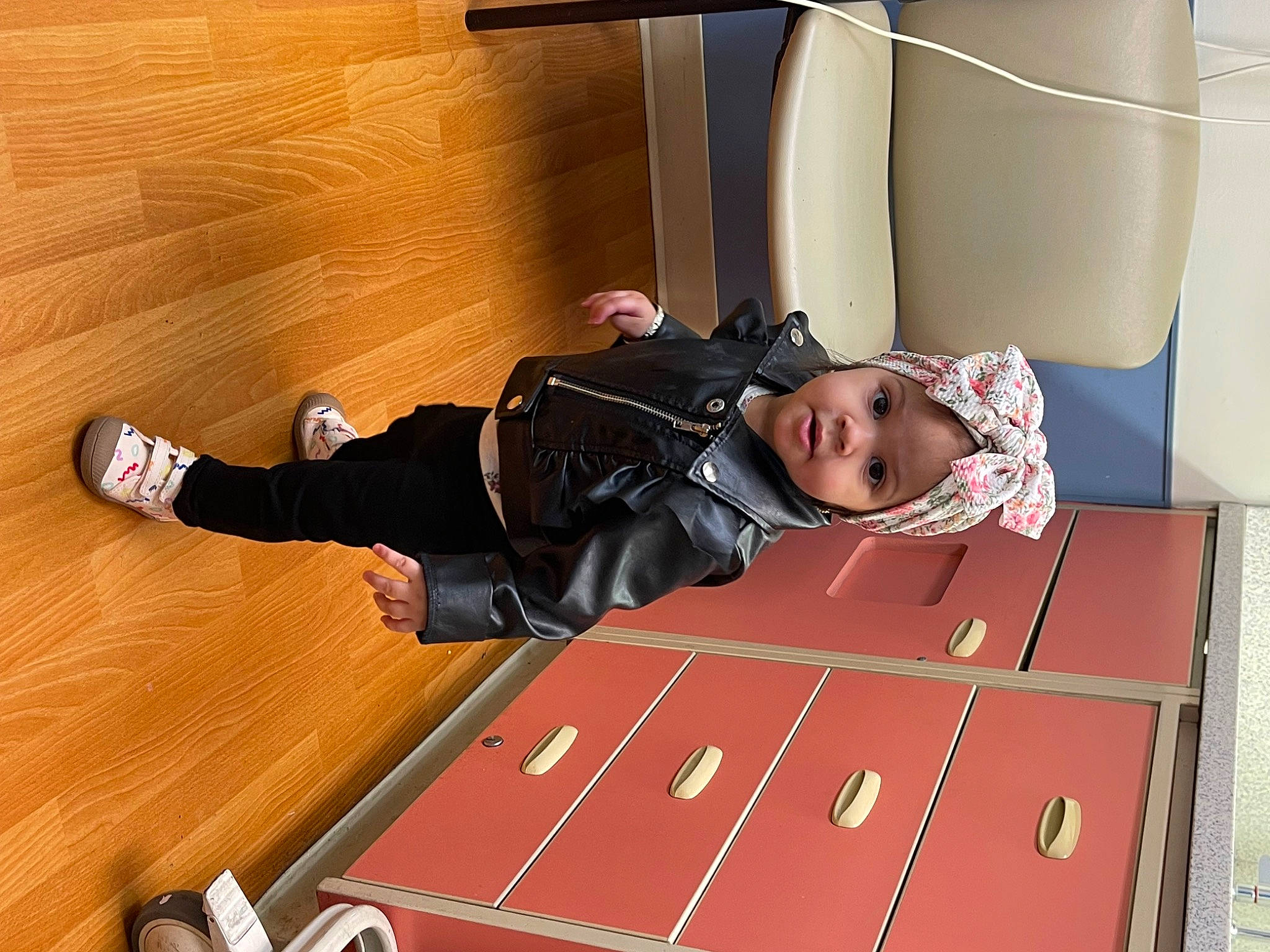 Mia'Maria joined the competition — help win amazing prizes! comfort, flooring, fun, hardwood, headwear, jacket, knee, outdoor_shoe, person, recreation, room, sitting, sneakers, sportswear, toddler, walking_shoe, wood, wood_flooring