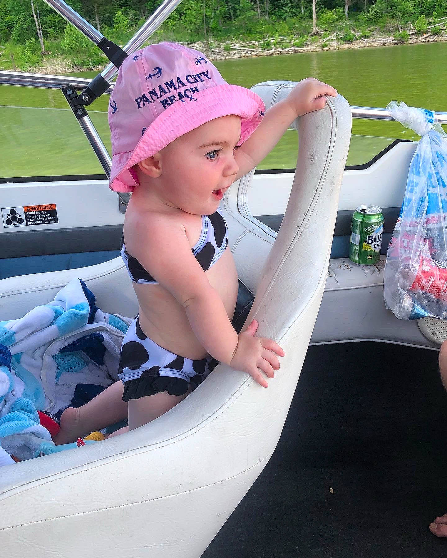 Emberlyn is registered to the contest to win money with this photo: baby, baseball_cap, boats_and_boating_equipment_and_supplies, bumper, cap, child, fedora, fun, games, hat, headwear, lap, leisure, person, personal_protective_equipment, pink, recreation, sun_hat, t_shirt, thigh