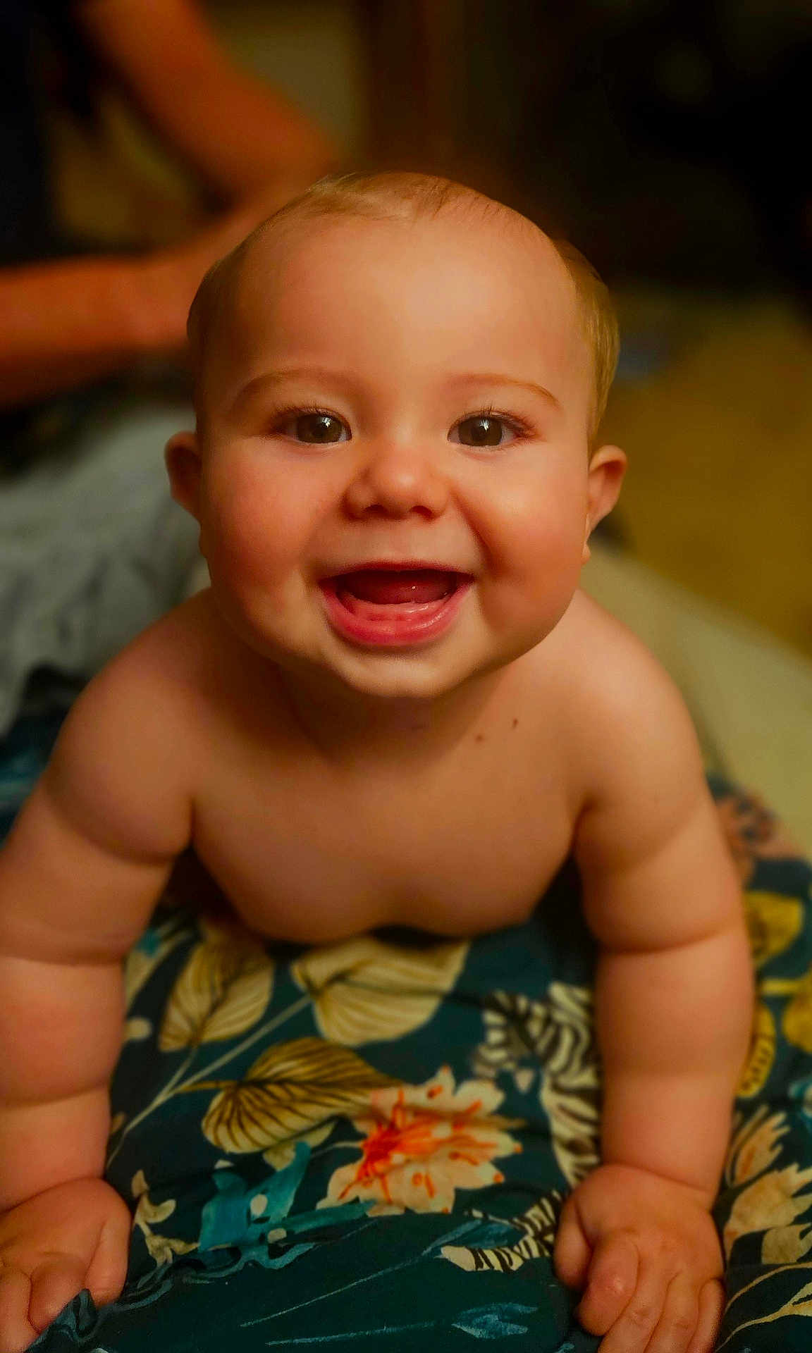 Oshin joined the competition — help win amazing prizes! baby, smiling, crawling, child, bare_chested, face, arms, floral_blanket, happy, indoors, cute, infant, skin, expression, young_child, closeup, portrait, person, bright_eyes, playful