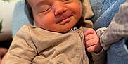 Olive is registered to the contest to win money with this photo: baby, infant, sleeping, smiling, clothing, zipper, hand, blanket, pillow, face, peaceful, cute, cozy, indoor, closeup, newborn, soft_texture, child, portrait, relaxation