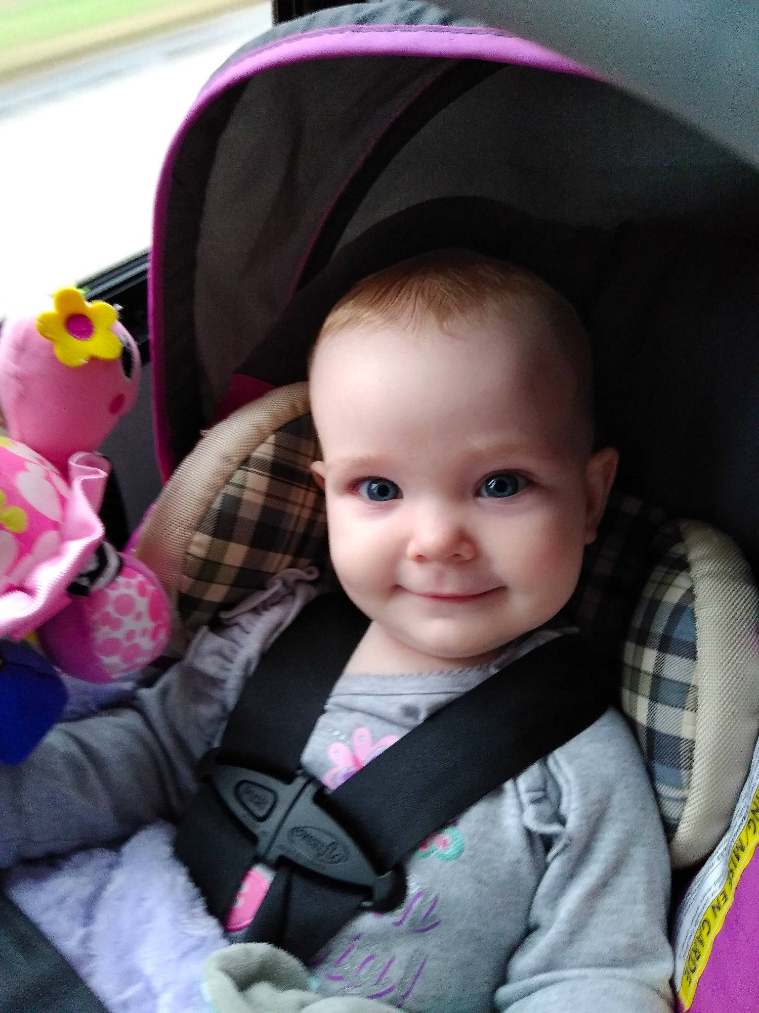 Joslyn is registered to the contest to win money with this photo: baby, baby_carriage, baby_in_car_seat, baby_products, beauty, car_seat, cheek, child, eye, face, head, joy, lip, nose, people, person, pink, product, purple, skin