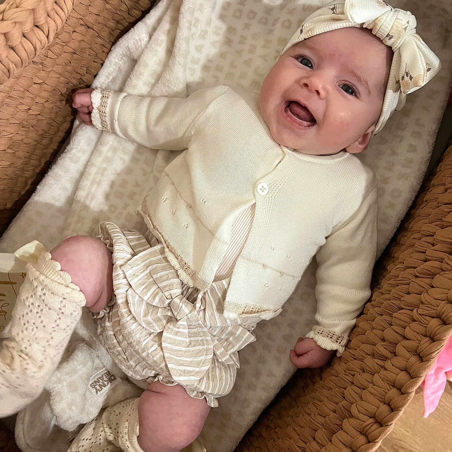 Lylah joined the competition — help win amazing prizes! baby, baby_girl, blanket, bow, child, clothing, cozy, cute, happy, headband, indoor, infant, knitted_booties, laying_down, newborn, portrait, smiling, soft_texture, warm, woven_basket