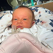 Ivy-Leigh is registered to the contest to win money with this photo: newborn, baby, blanket, pacifier, face, clothing, indoor, portrait, infant, cute, soft, resting, fan, furniture, home, person, young_child, sleepy, cozy, comfort