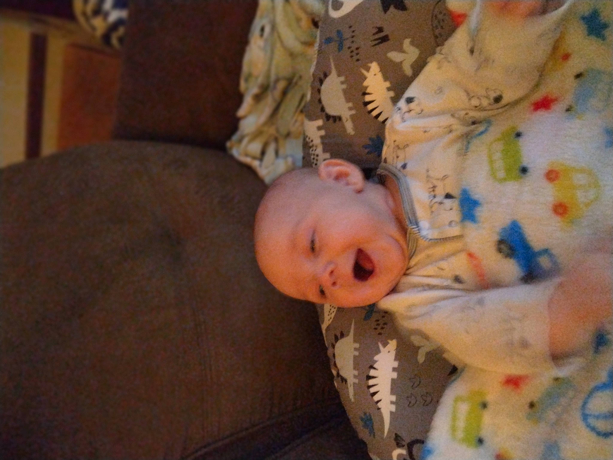 Layne is registered to the contest to win money with this photo: baby, baby_toddler_clothing, cheek, child, comfort, flooring, fun, happy, linens, person, room, sitting, skin, toddler, tree, wood