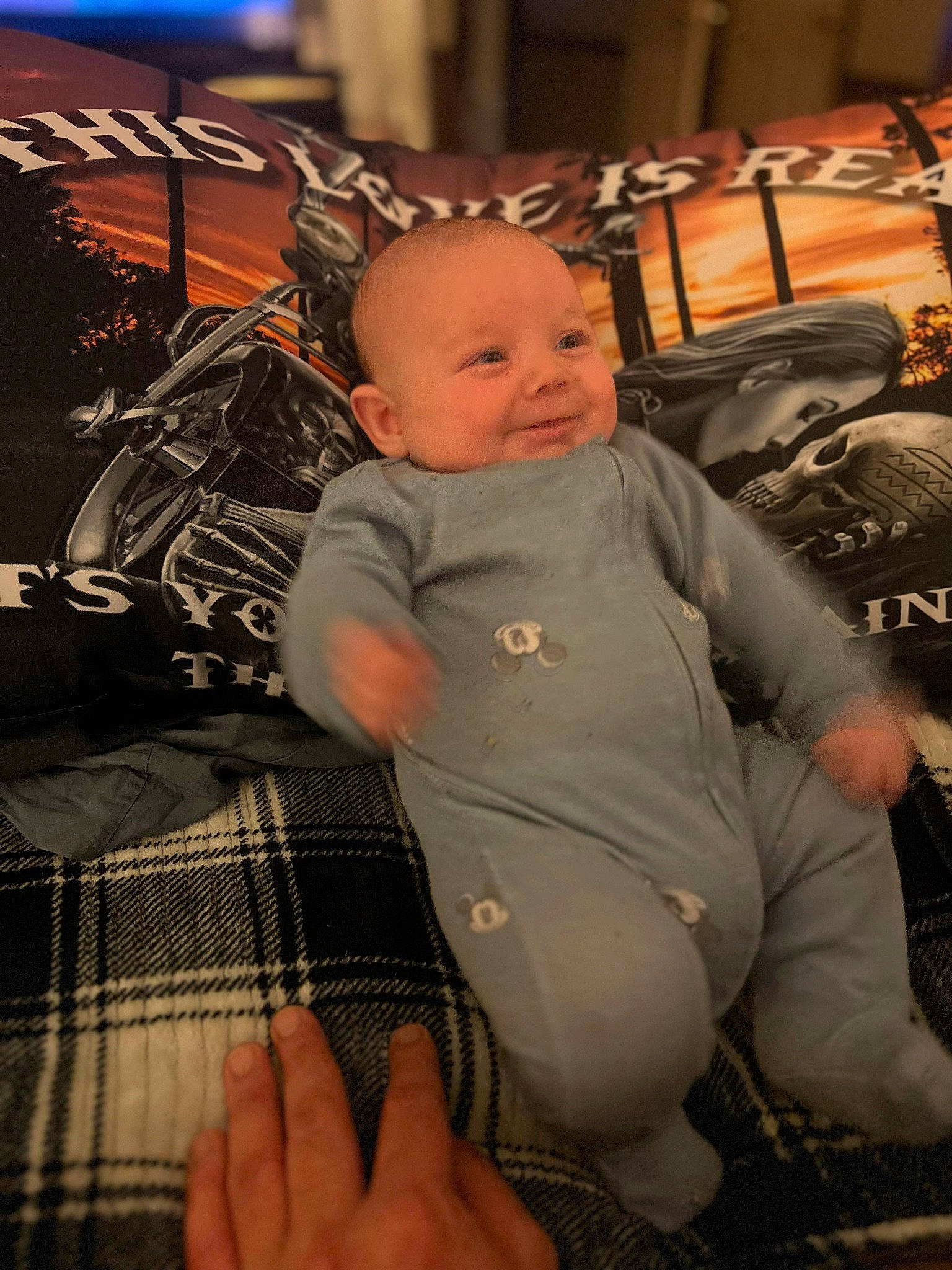 Layne is registered to the contest to win money with this photo: automotive_tire, baby, baby_toddler_clothing, child, comfort, flash_photography, fun, happy, human_body, human_leg, lap, pattern, person, plaid, room, sitting, skin, smile, tartan, thigh