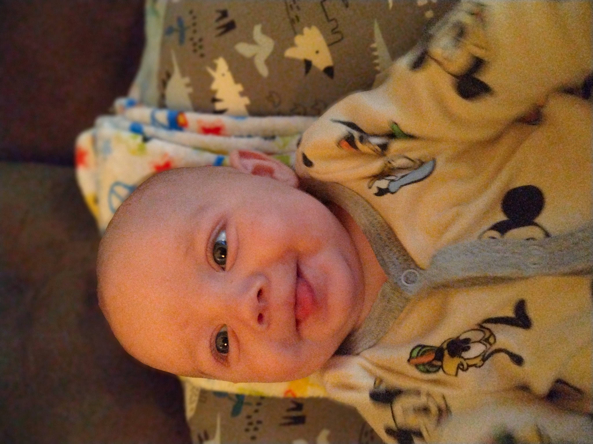 Layne is registered to the contest to win money with this photo: baby, baby_products, baby_toddler_clothing, bed, bedding, cheek, child, eye, eyebrow, fun, happy, joy, linens, mouth, nose, pattern, person, skin, smile, toddler